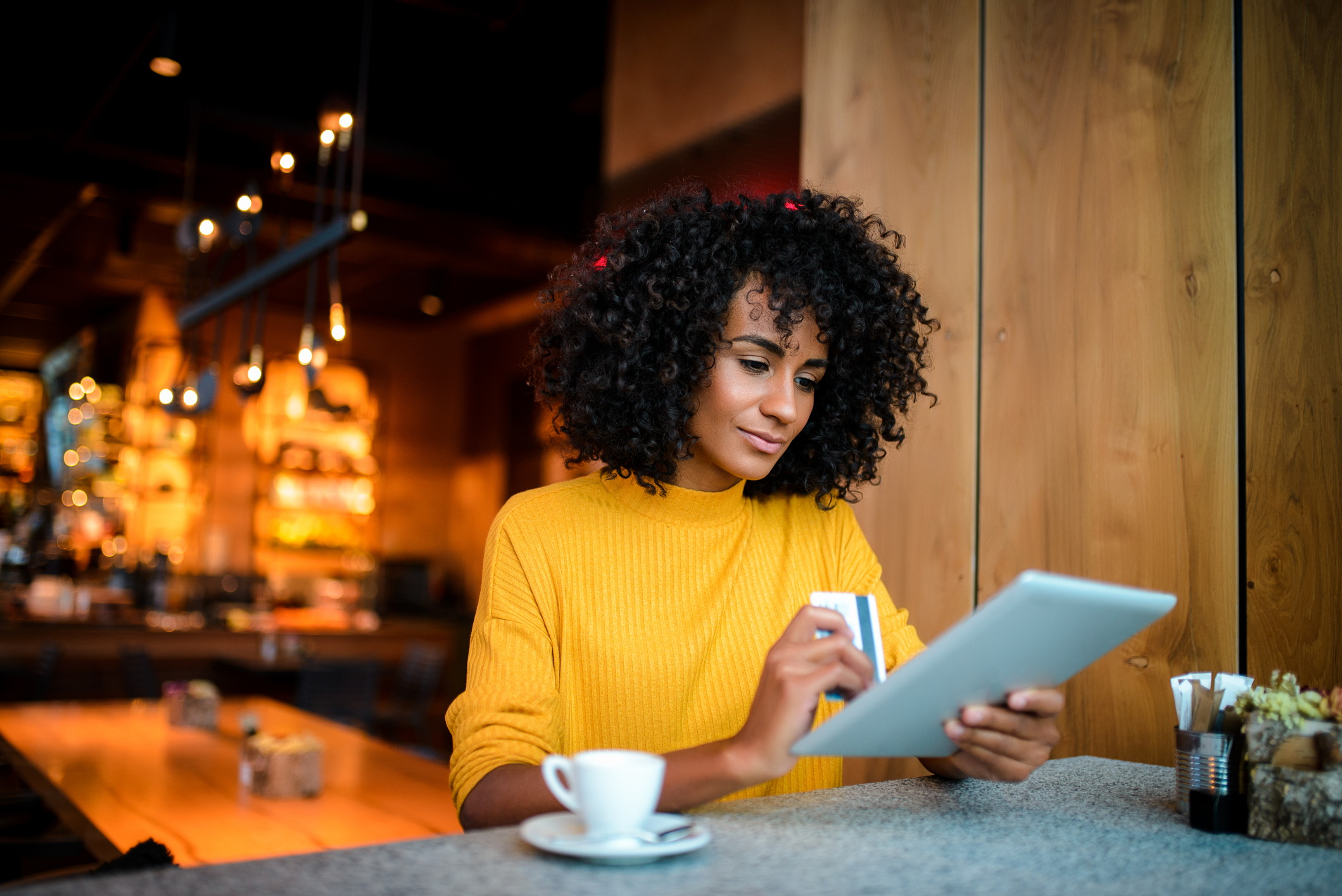 Woman looking at credit card information
